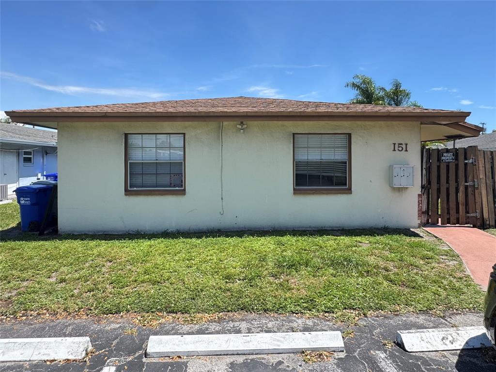 151 Southwest 15th Street Pompano Beach, FL 33060 - Photo 31 of 36 a view of a house with a yard