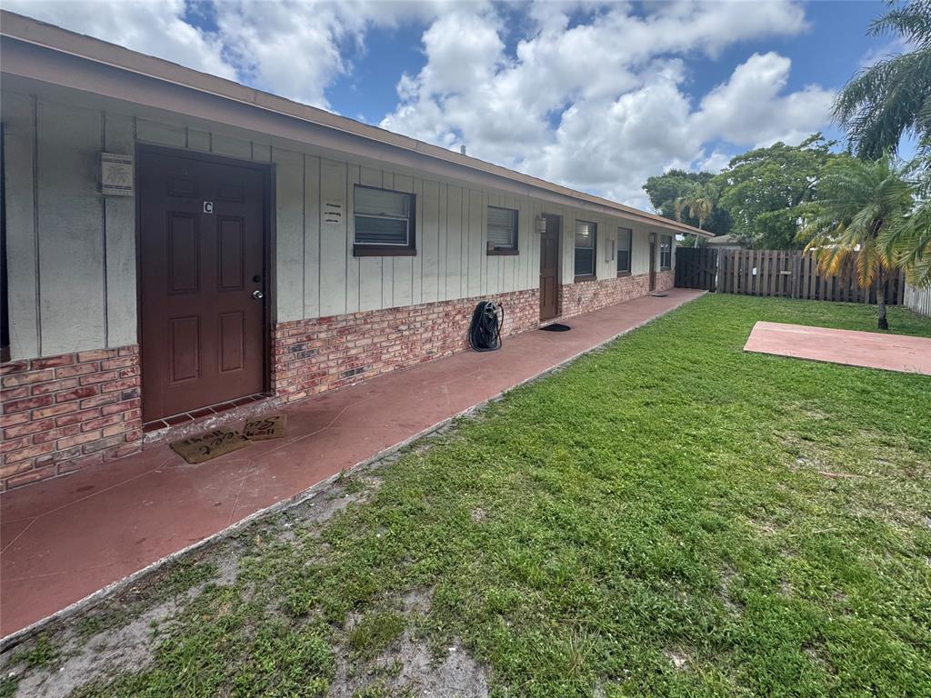151 Southwest 15th Street Pompano Beach, FL 33060 - Photo 35 of 36 a view of a house with backyard and porch