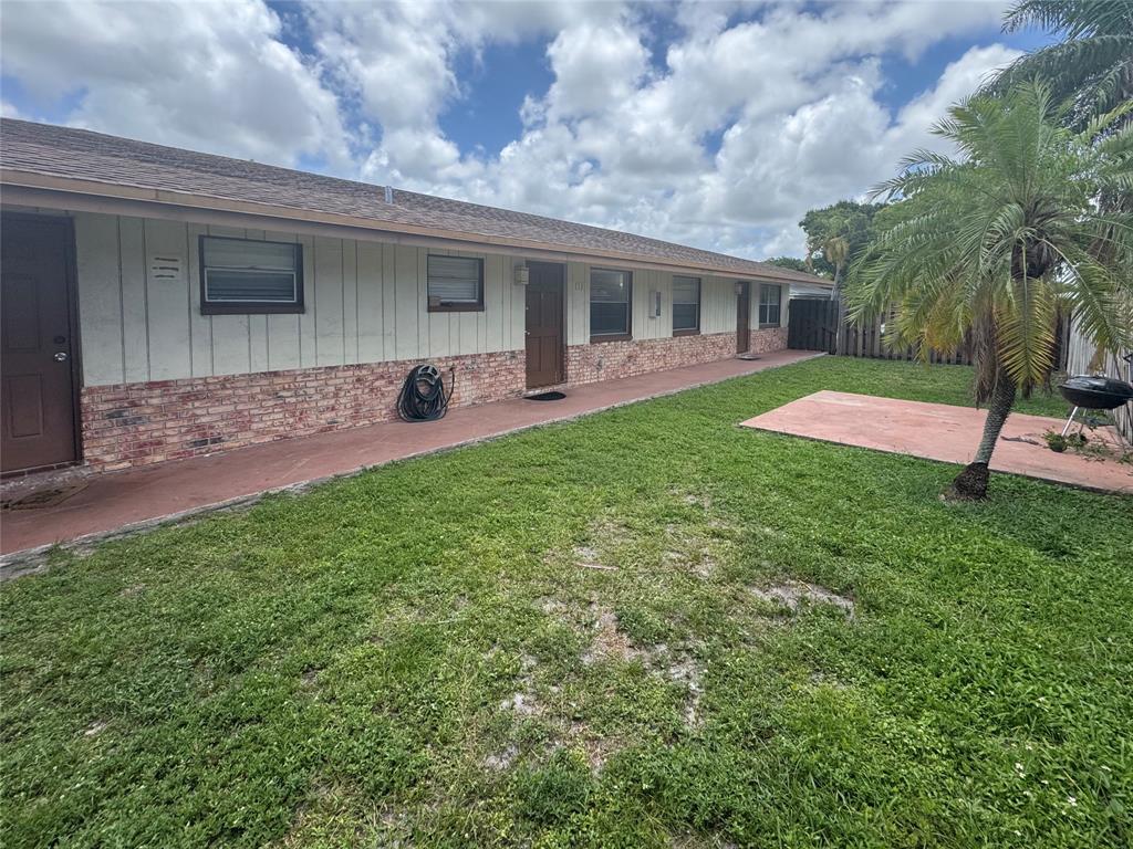 151 Southwest 15th Street Pompano Beach, FL 33060 - Photo 36 of 36 a front view of house with yard and green space