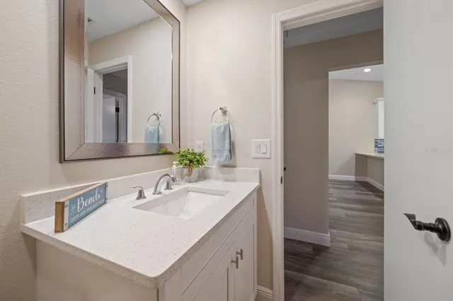 a bathroom with a sink and a mirror