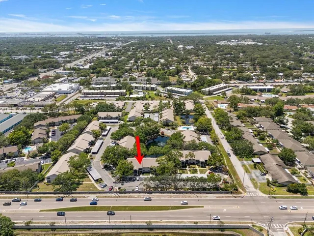 an aerial view of residential houses with city view