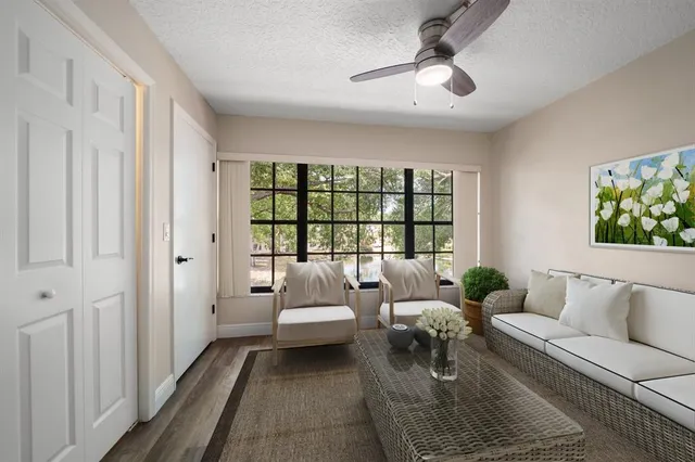 a living room with furniture and a rug