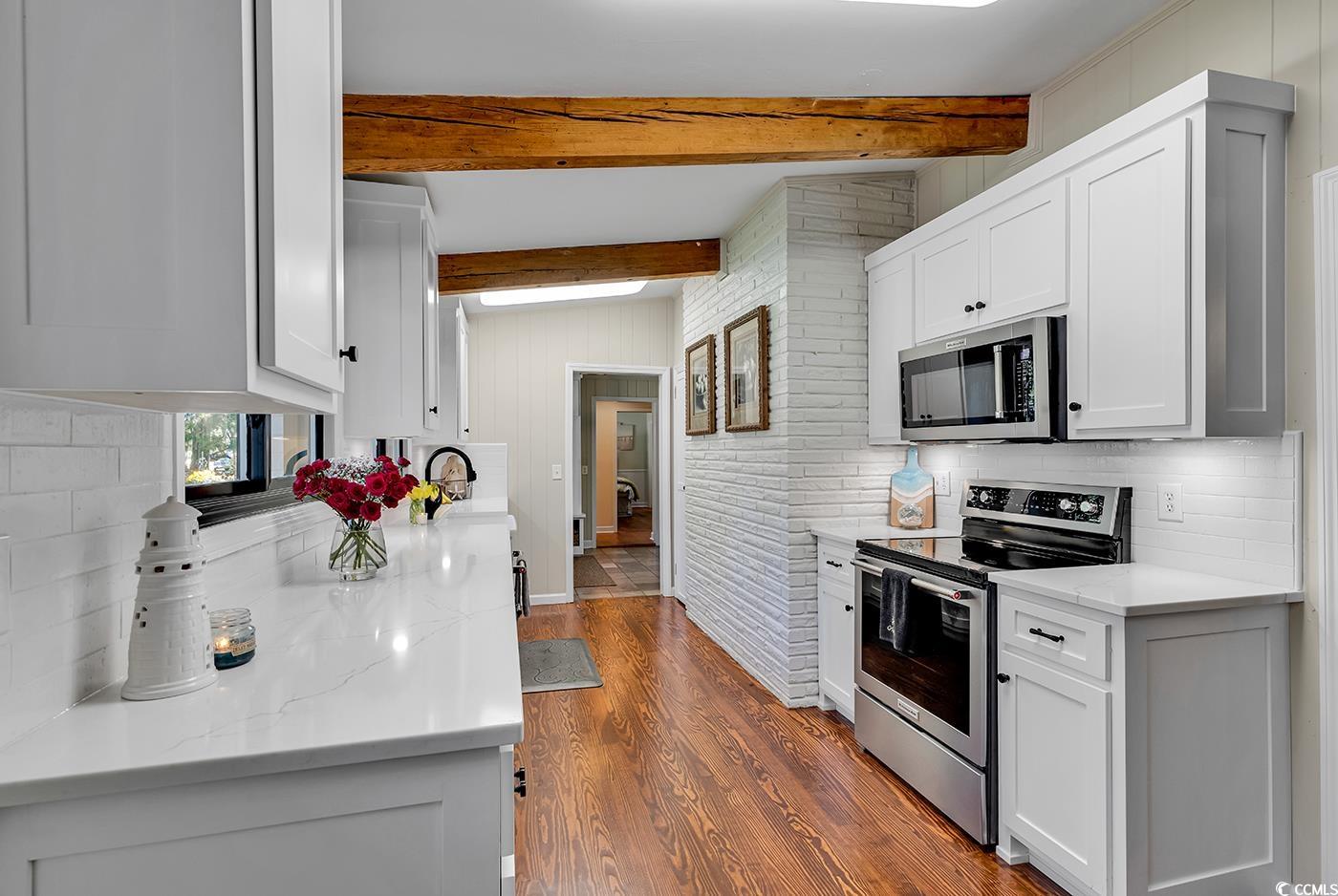1202 Prince William Road North Myrtle Beach, SC 29582 - Photo 18 of 40 Kitchen featuring lofted ceiling with beams, appli
