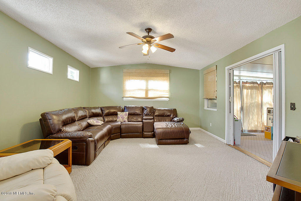1866 Clemson Road Jacksonville, FL 32217 - Photo 11 of 21 a living room with furniture and a window