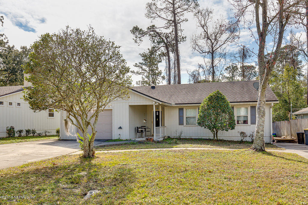 1866 Clemson Road Jacksonville, FL 32217 - Photo 3 of 21 a front view of house with yard and trees around