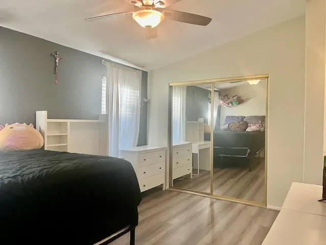 a bedroom with a bed and a walk in closet