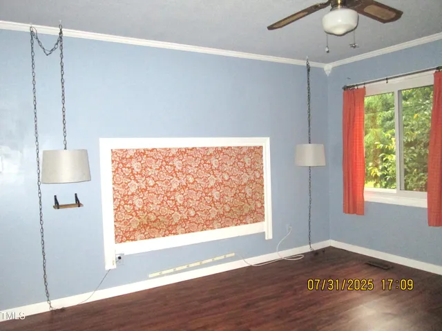 a view of a livingroom with wooden floor