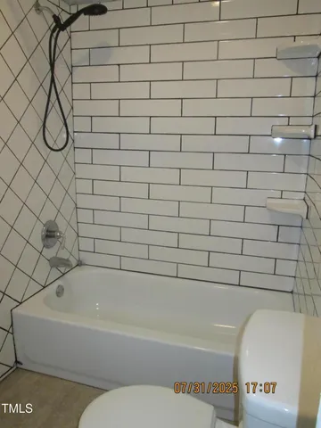 a living room with furniture a window and a shower