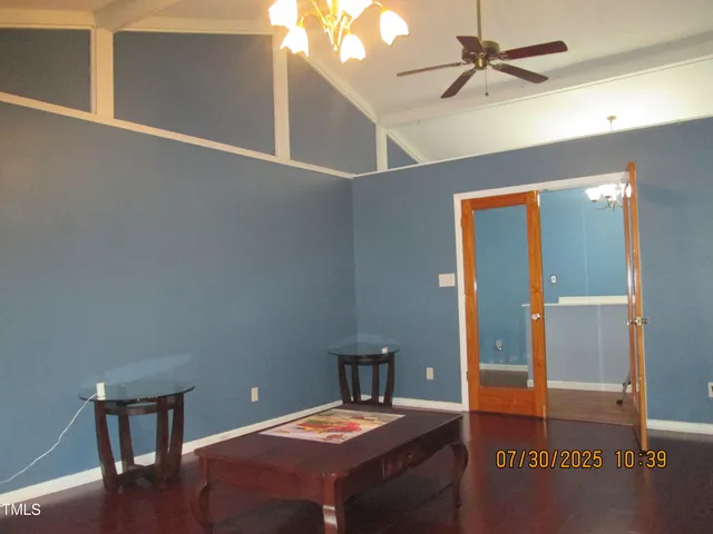 a room with a table and a potted plant