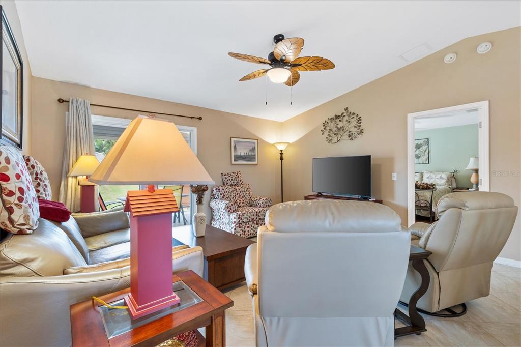 470 Oboe Way The Villages, FL 32162 - Photo 12 of 42 a living room with furniture and a large window