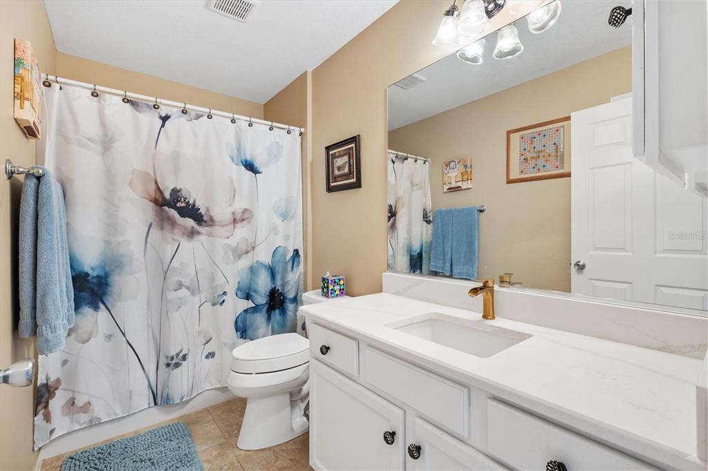 470 Oboe Way The Villages, FL 32162 - Photo 18 of 42 a bathroom with a sink a toilet and shower
