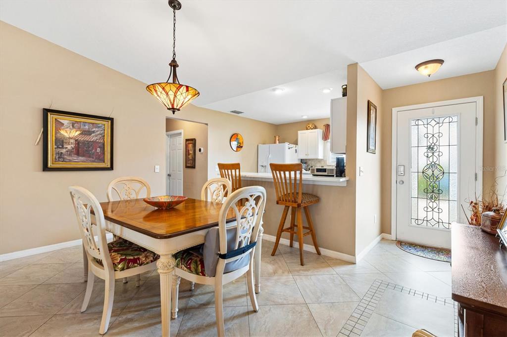 470 Oboe Way The Villages, FL 32162 - Photo 7 of 42 a dining room with furniture and window