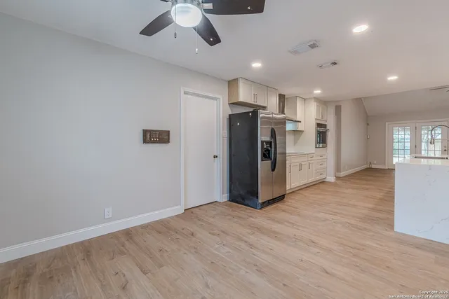a view of kitchen with furniture and wooden floor