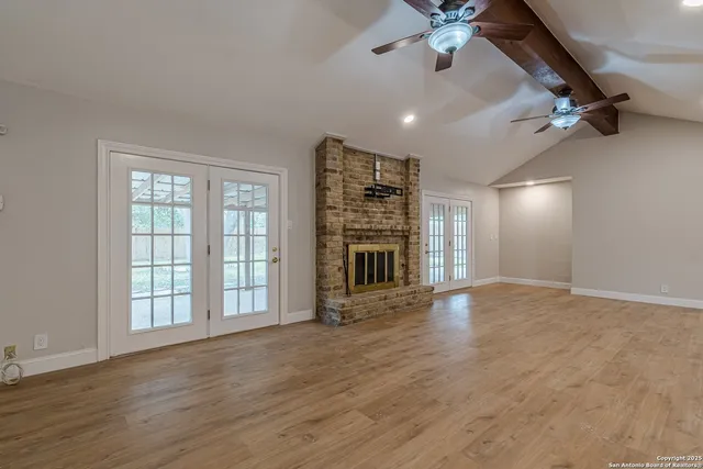 a large kitchen with stainless steel appliances granite countertop a large counter top and a stove