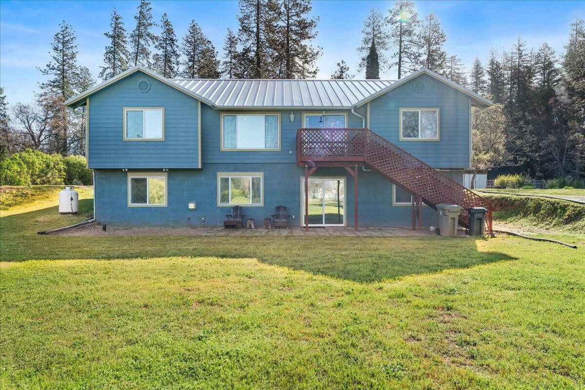 649 Pleasant Valley Road Merlin, OR 97532 - Photo 5 of 57 a view of a yard in front of a house with large trees