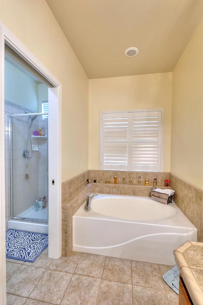 4152 Post Oak Drive Turlock, CA 95382 - Photo 56 of 71 a spacious bathroom with a bathtub and shower