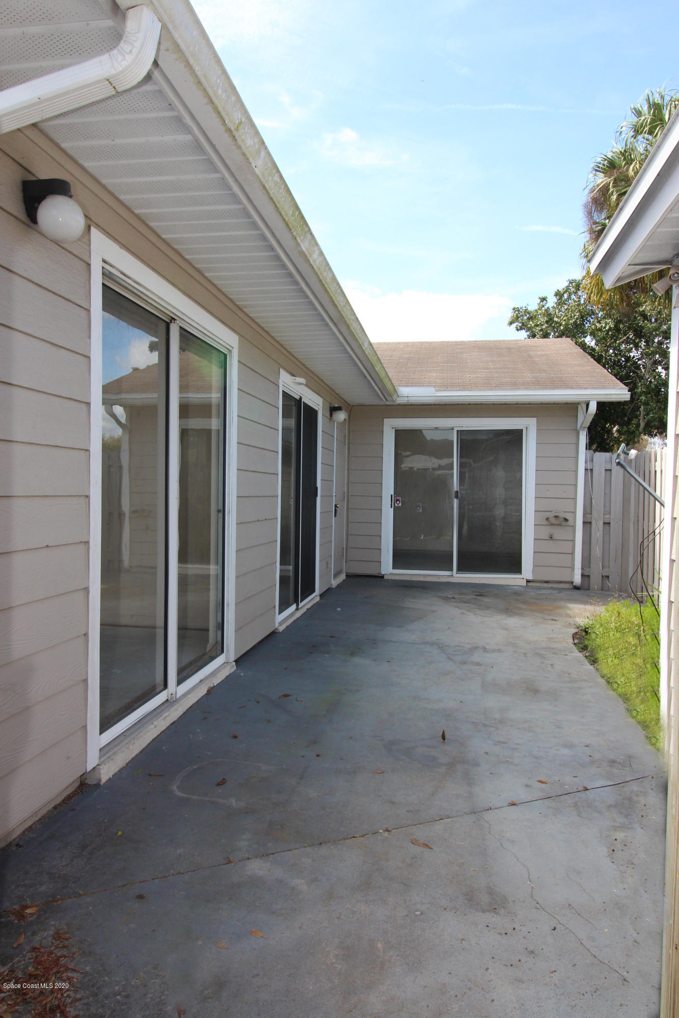 1940 Quail Ridge Court, Unit 402 Cocoa, FL 32926 - Photo 1 of 17 Courtyard - IMG_5859