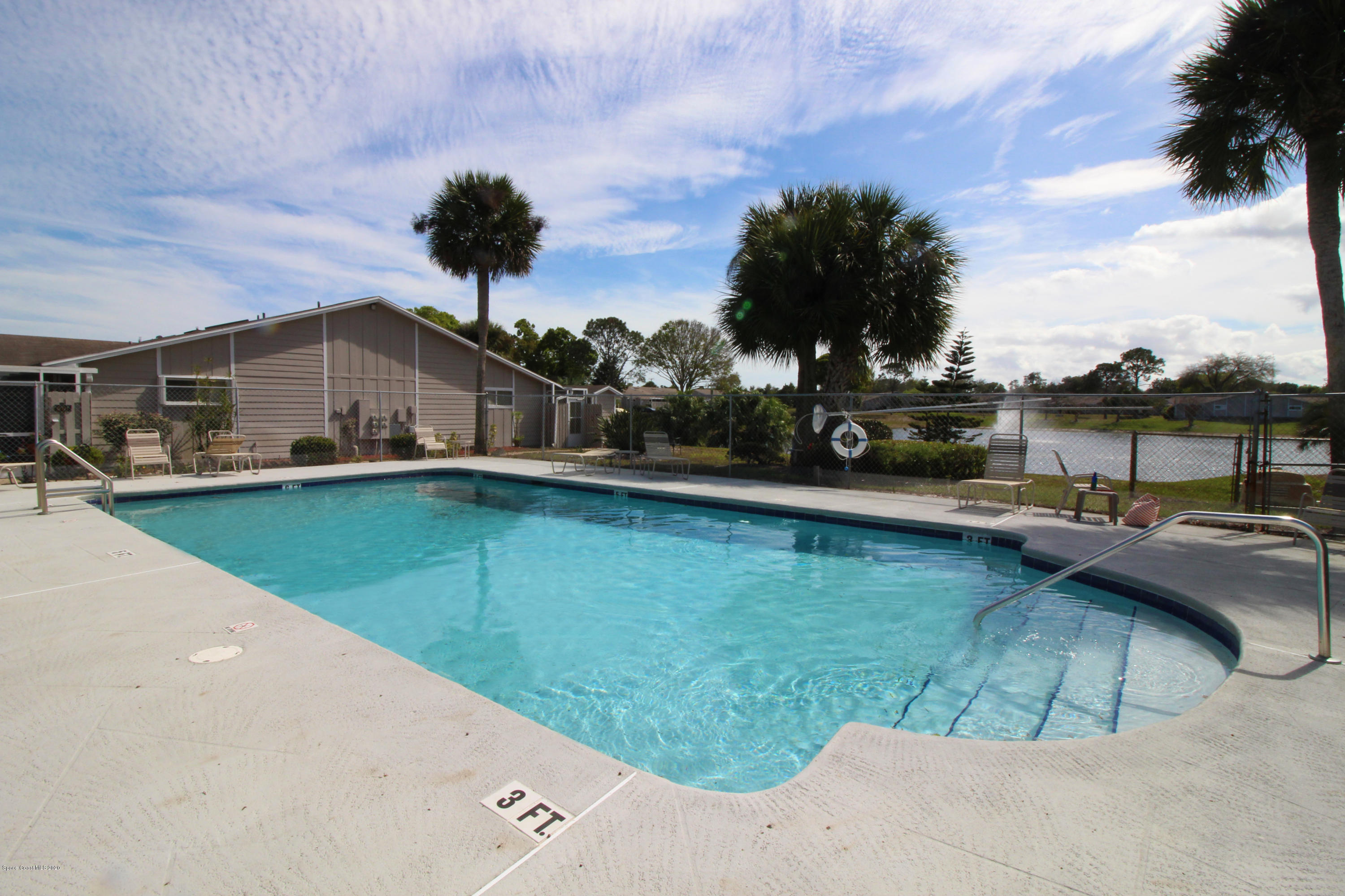 1940 Quail Ridge Court, Unit 402 Cocoa, FL 32926 - Photo 3 of 17 Clubhouse Pool