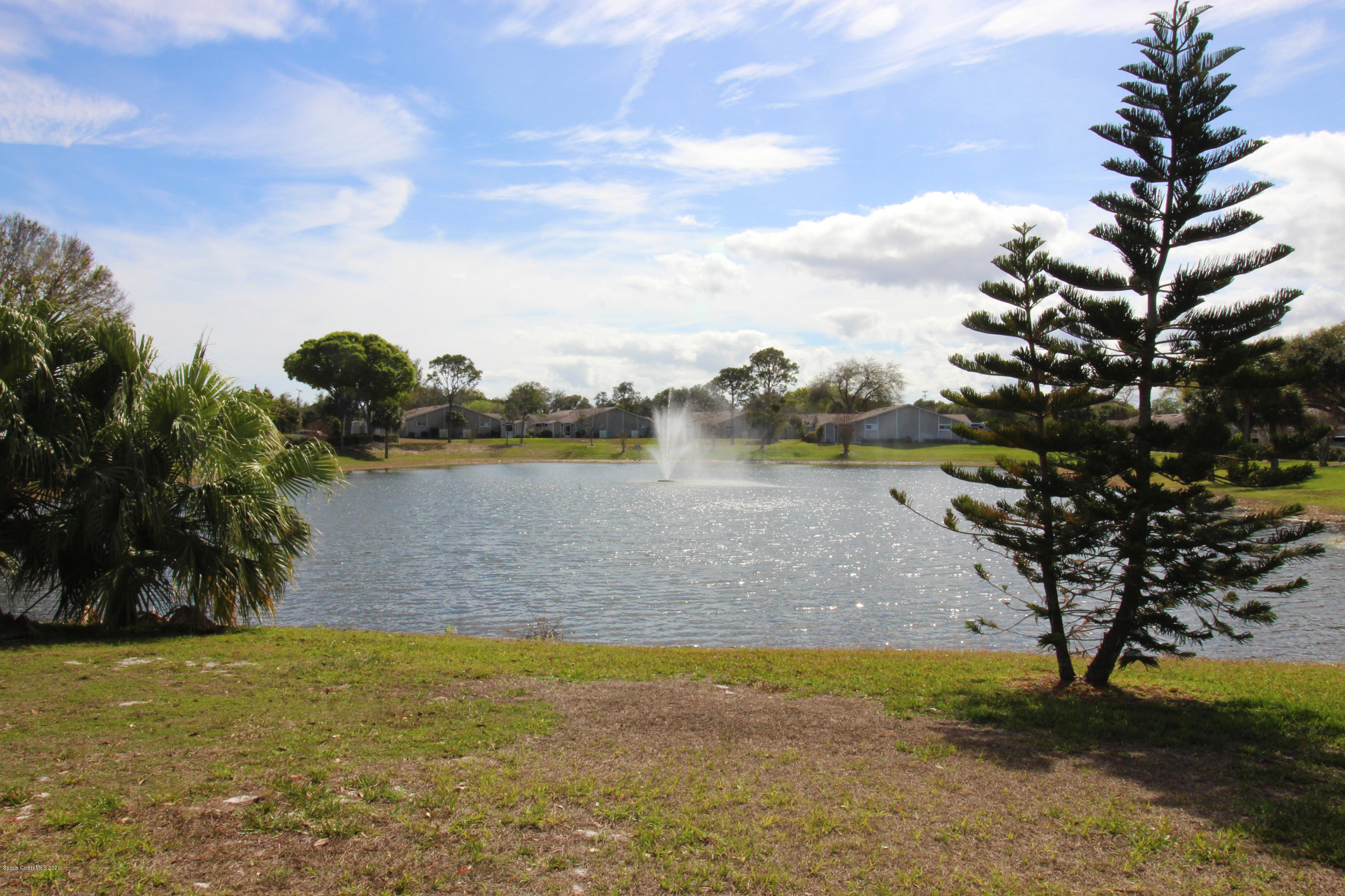 1940 Quail Ridge Court, Unit 402 Cocoa, FL 32926 - Photo 6 of 17 Community Pond
