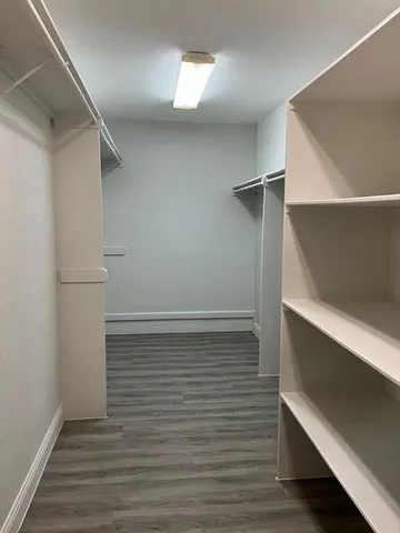 a view of an empty walk in closet