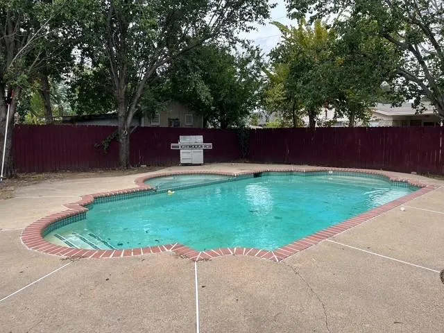 a view of a backyard with a small cabin