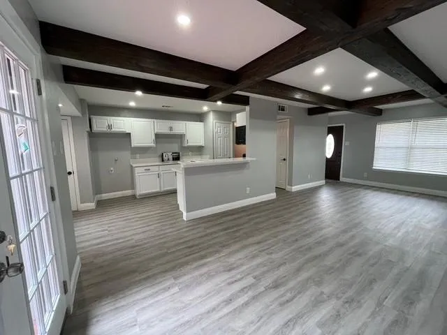 a view of a big room with wooden floor