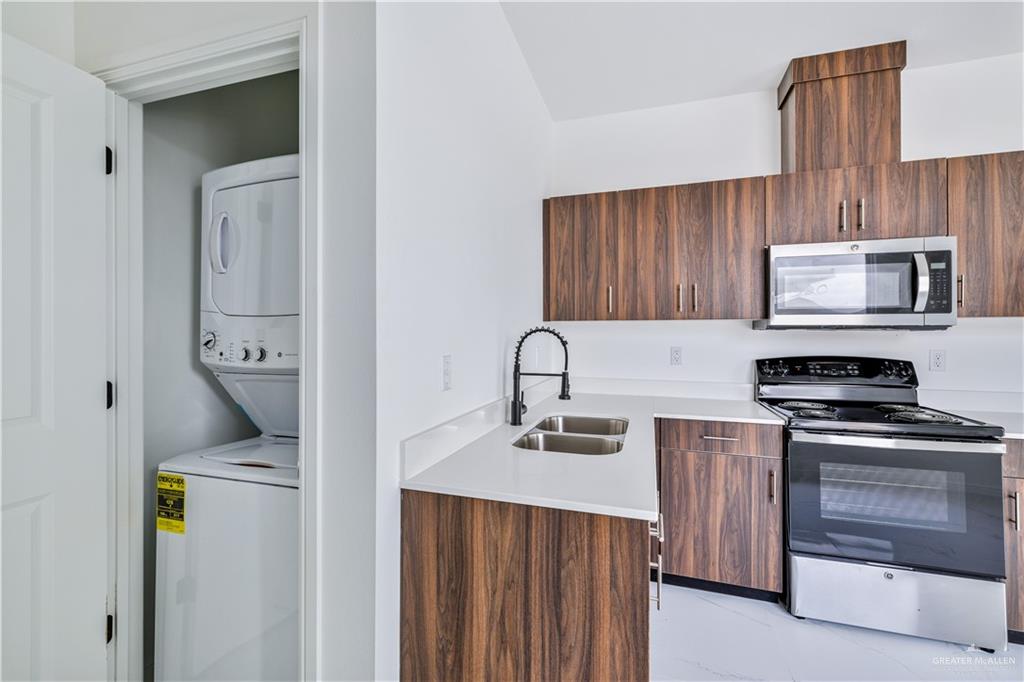 5322 Vision Street Rio Grande City, TX 78582 - Photo 7 of 20 a kitchen with appliances a sink and cabinets