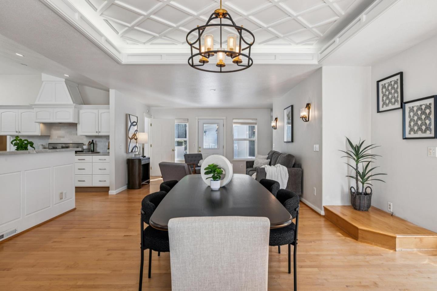 2905 Bird Rock Road Pebble Beach, CA 93953 - Photo 20 of 33 a view of a dining room with furniture a chandelier and wooden floor