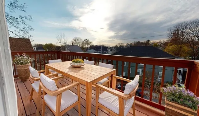 a view of a balcony with wooden floor