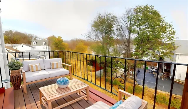a balcony with wooden floor