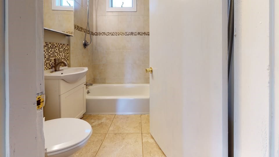 75 Cherry Street, Unit 2 Malden, MA 02148 - Photo 17 of 17 a bathroom with a toilet and a bathtub