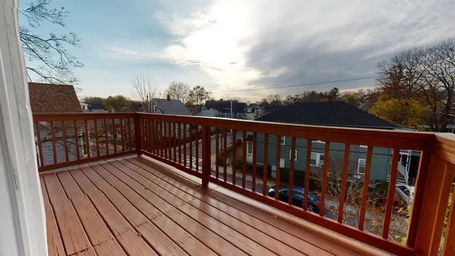 a view of balcony with wooden floor