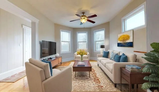 a living room with furniture and a flat screen tv