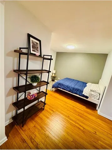 a bedroom with furniture and a window