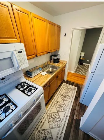 a kitchen with a stove and a refrigerator
