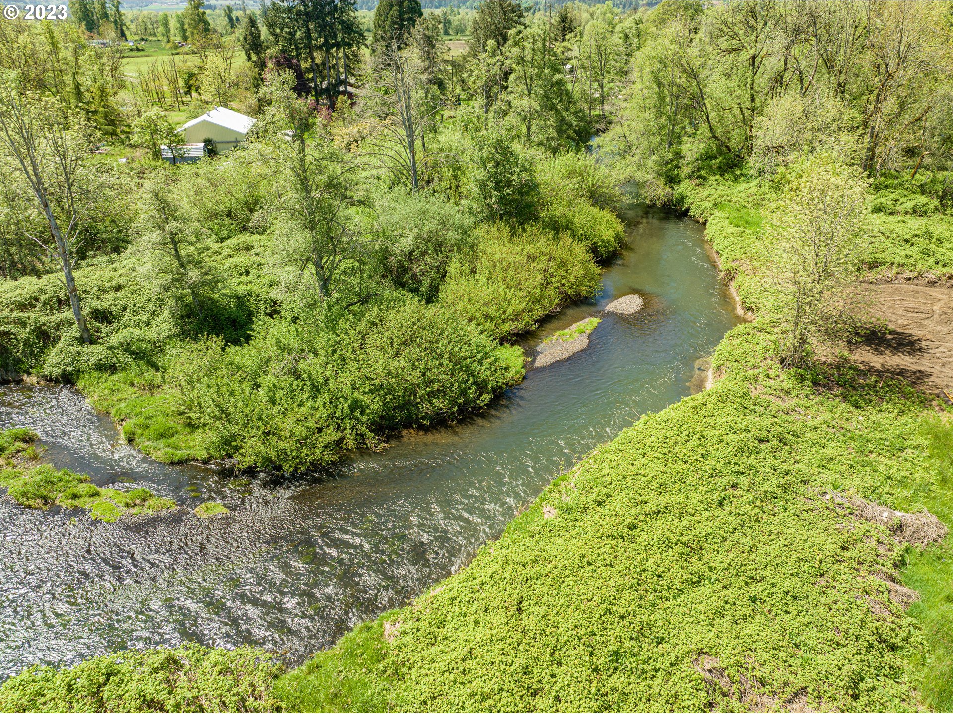 7979 Marion Road Southeast Turner, OR 97392 - Photo 5 of 6 a view of a lake with a yard