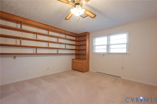 a room with window and ceiling fan