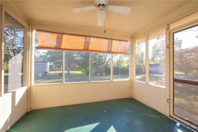 a view of an empty room with a window