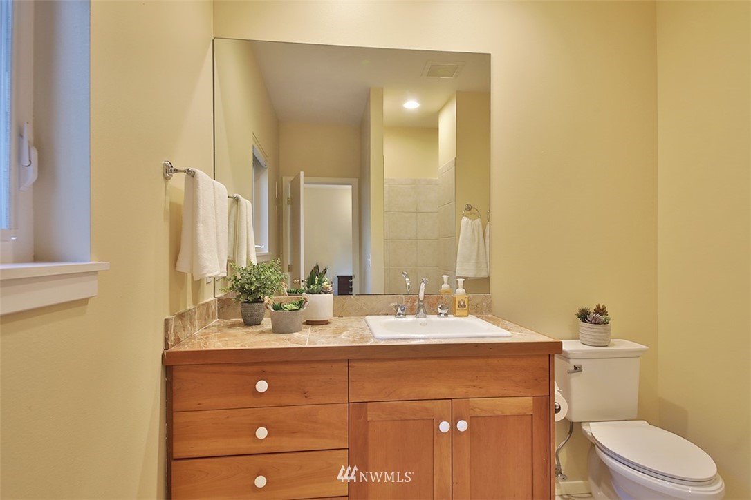 5657 Cameron Road Freeland, WA 98249 - Photo 22 of 40 a bathroom with a double vanity sink mirror and toilet