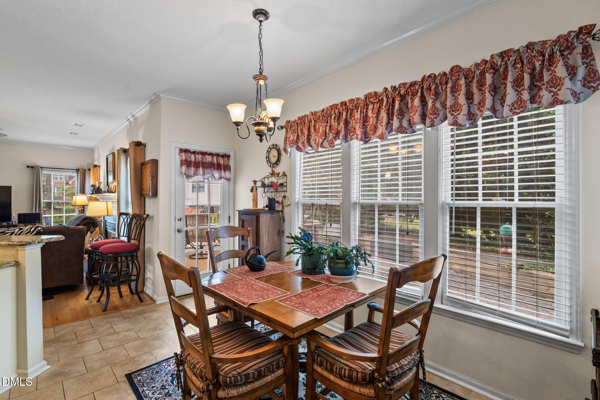 9104 Deerland Grove Drive Raleigh, NC 27615 - Photo 11 of 42 Breakfast Room into Family Room