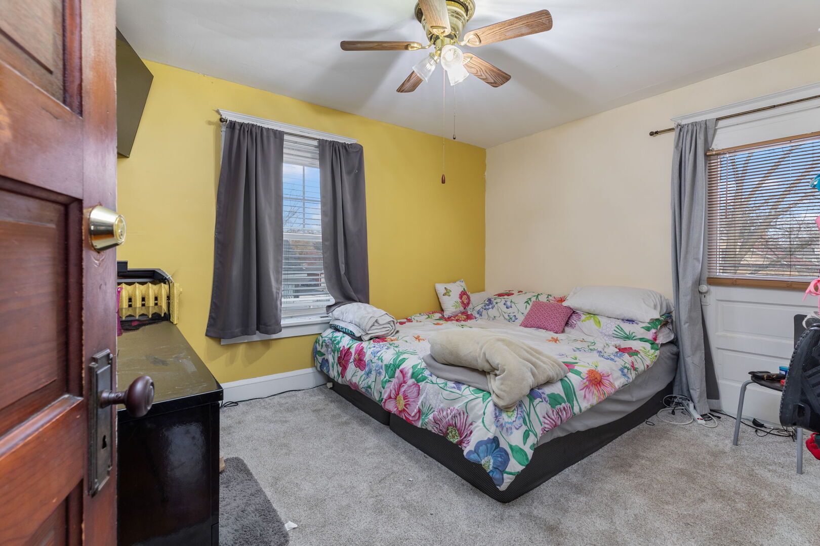 610 Watson Street Aurora, IL 60505 - Photo 12 of 15 a bedroom with a bed and wooden floor