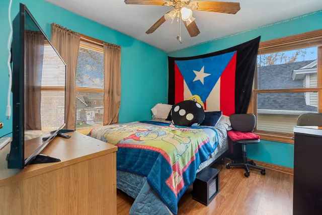 a bedroom with a bed and a window