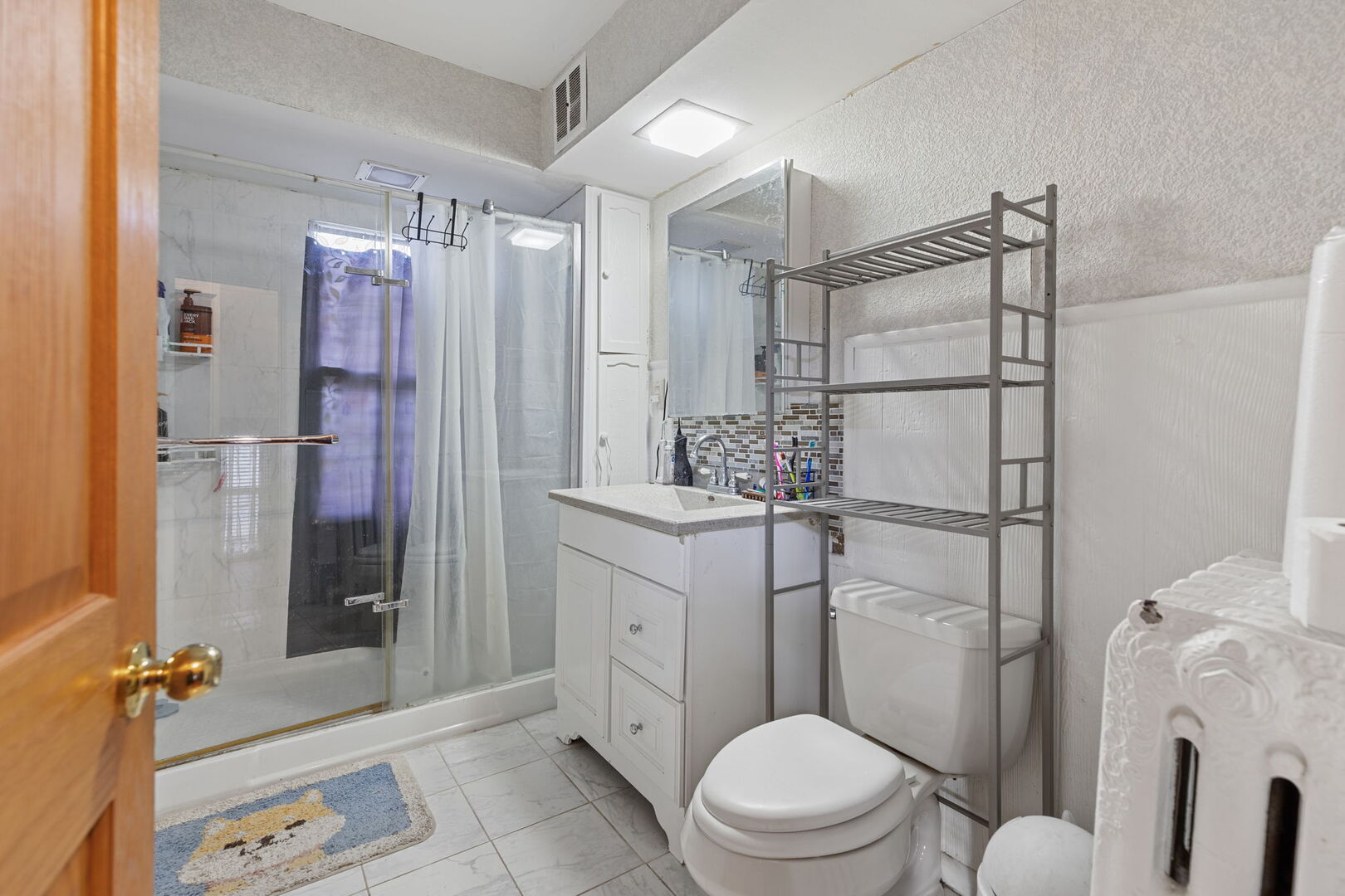 610 Watson Street Aurora, IL 60505 - Photo 13 of 15 a bathroom with a sink toilet and shower