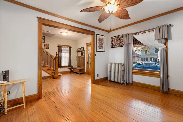 a view of livingroom with hardwood floor and ceiling fan