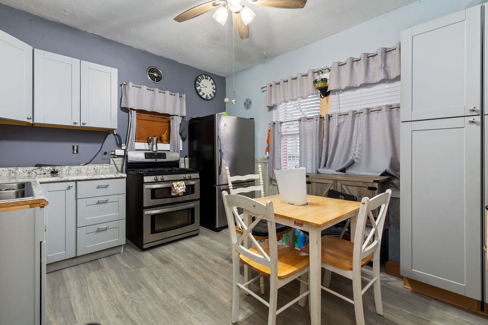 610 Watson Street Aurora, IL 60505 - Photo 9 of 15 a kitchen with stainless steel appliances a stove refrigerator sink and microwave