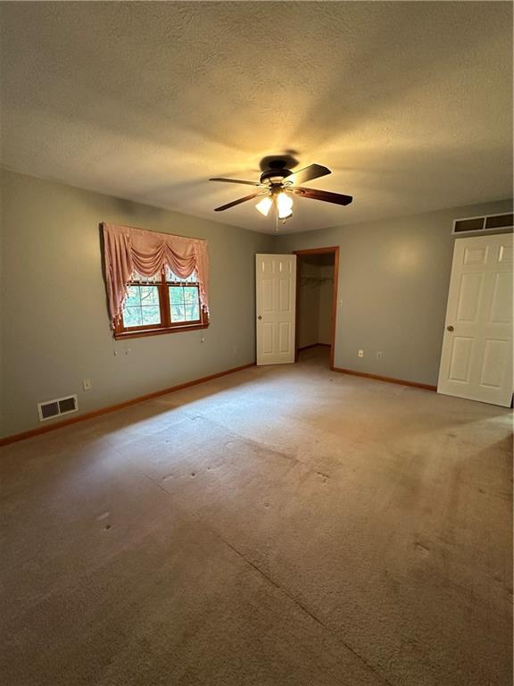 131 Windy Drive Butler, PA 16001 - Photo 16 of 24 an empty room with windows and chandelier fan