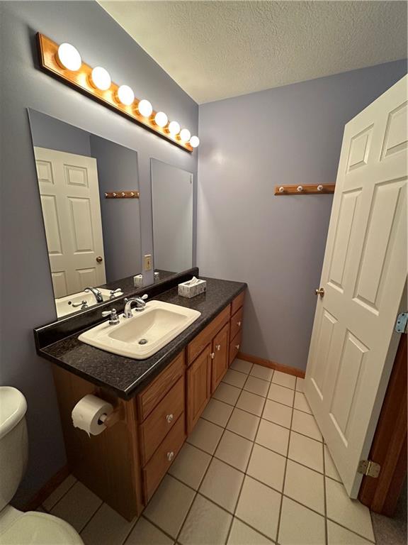 131 Windy Drive Butler, PA 16001 - Photo 19 of 24 a bathroom with a sink toilet and mirror