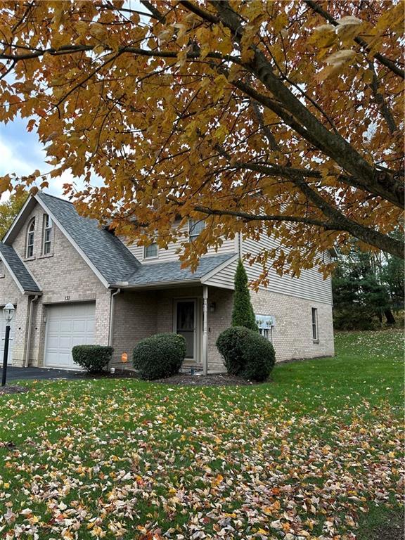 131 Windy Drive Butler, PA 16001 - Photo 2 of 24 a front view of a house with a garden