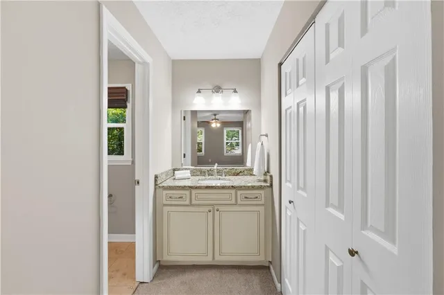 a bathroom with a double vanity sink and a mirror