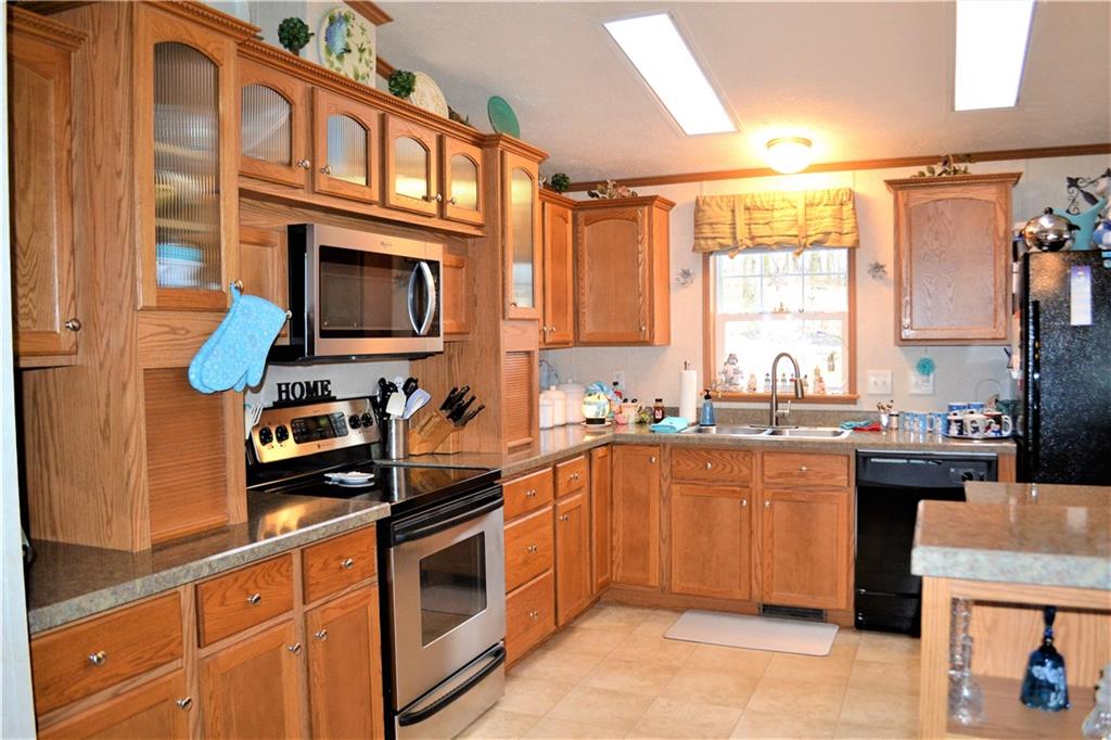 222 Toy Road Kittanning, PA 16201 - Photo 3 of 25 a kitchen with stainless steel appliances a stove a sink and a microwave